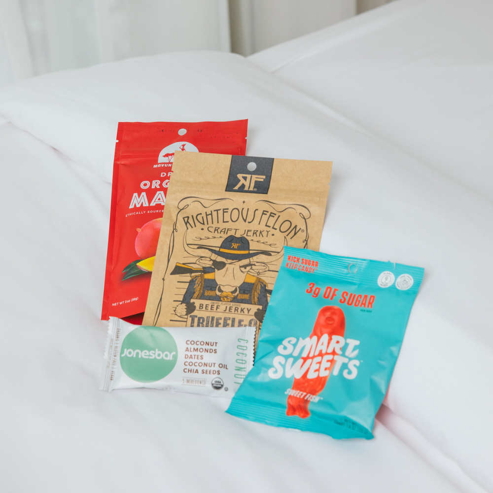 RTZN Snacks on Hotel Bed