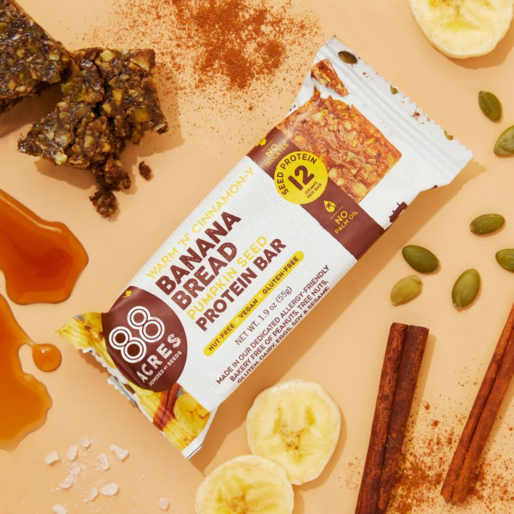 Banana Bread Protein Bar on orange background with ingredients